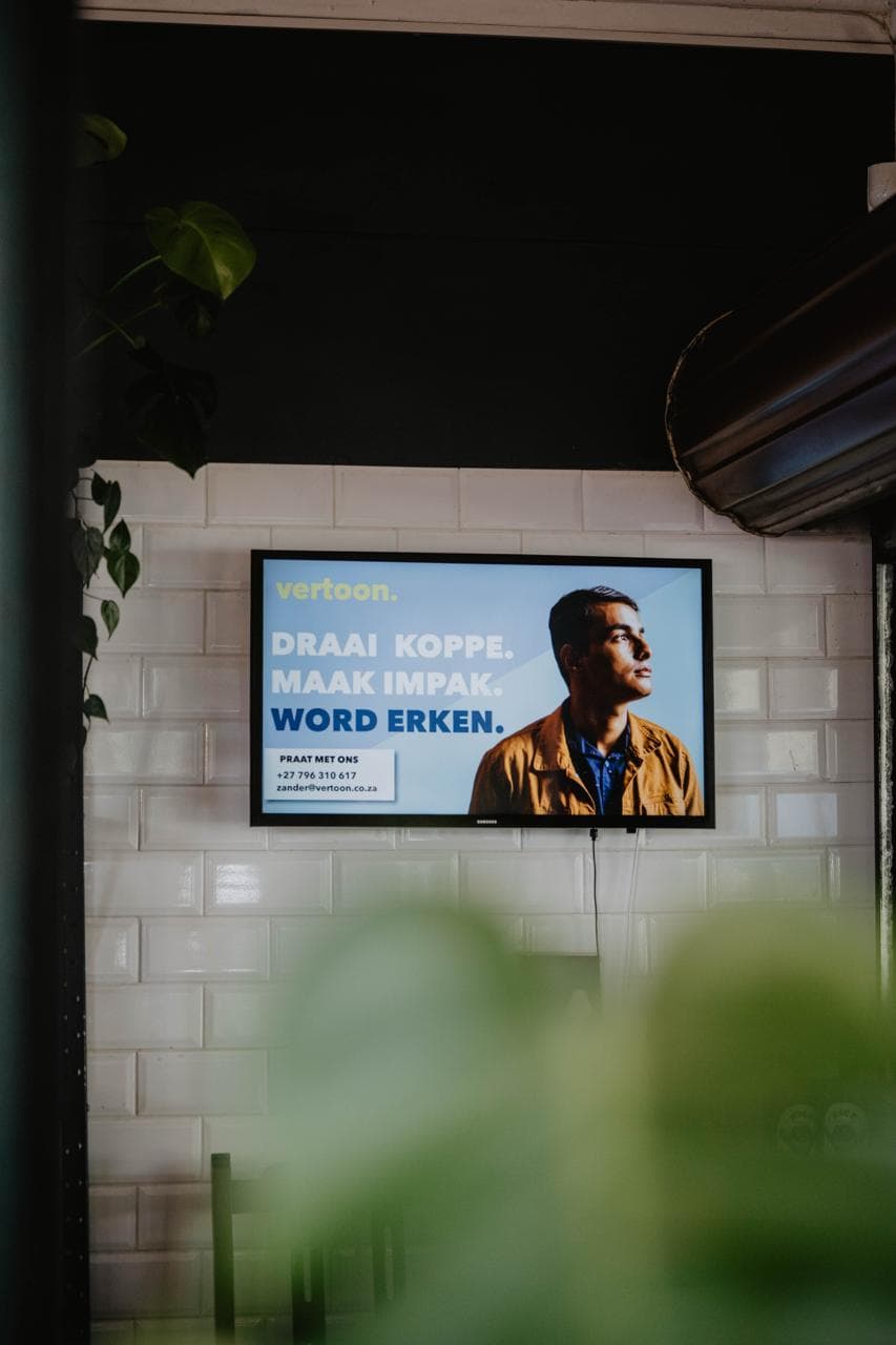 Digital signage displays in a modern office lobby